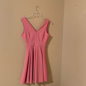 Pink v-neck pleated girls dress.